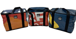 upcycled, recycled, banner, billboard, bag, tote, messenger, backpack, made in USA, upcycled banner bag, billboard, sewn in USA banner bag, recycled banner, tote, laptop, backpack, pouch