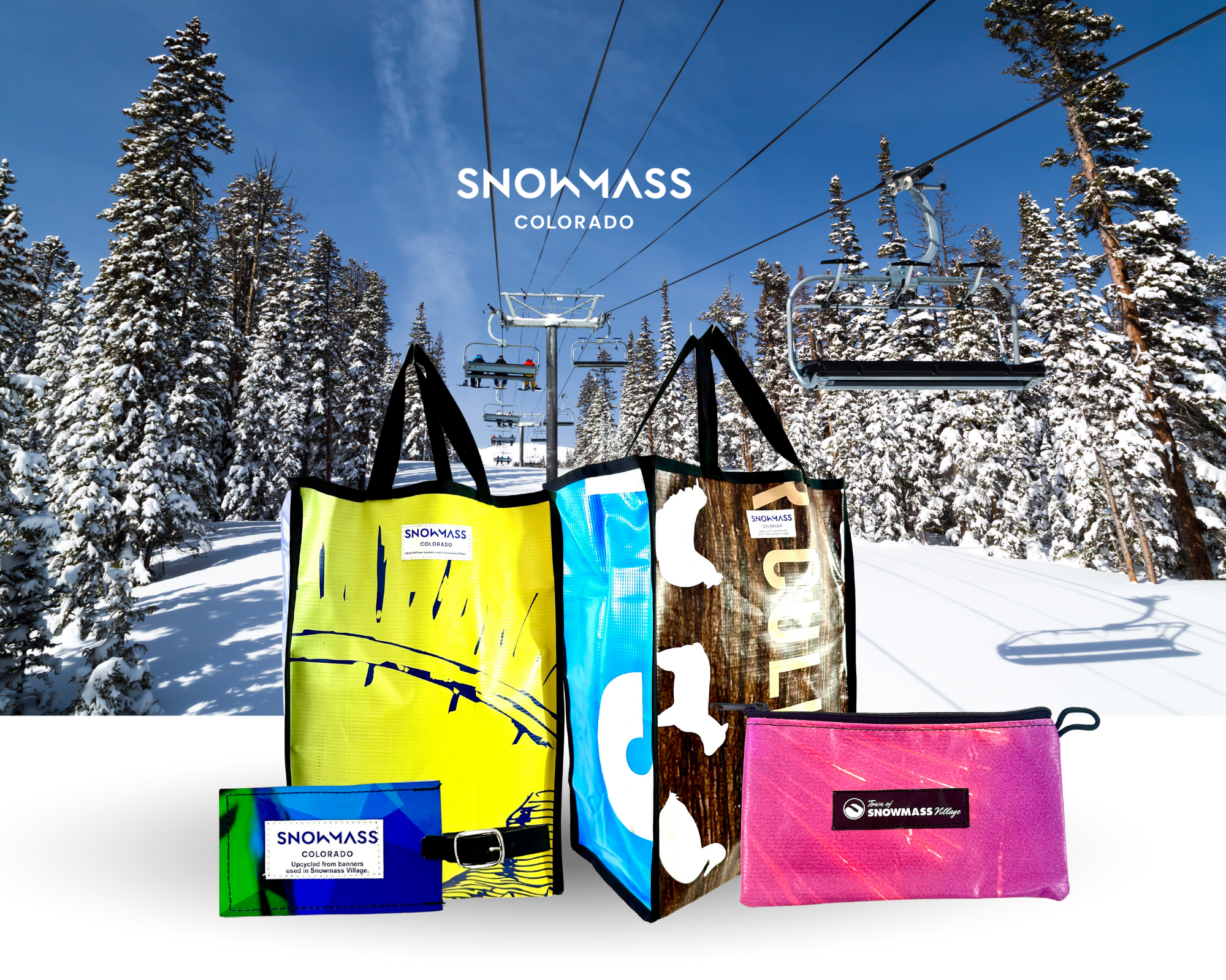 Vertical tote bag, pouch and luggage created from repurposed Snowmass Tourism vinyl banner, showcasing sustainable branding.